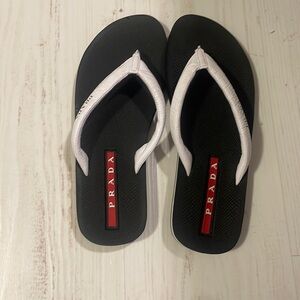 worn once inside prada flip flops.